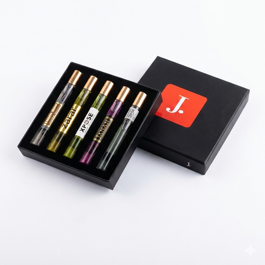 Set of five small glass bottles with metal caps in a black box with a red 'J' logo on a white background