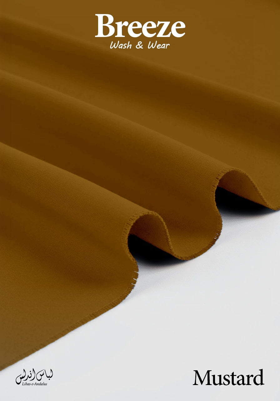Mustard-colored fabric with 'Breeze Wash & Wear' branding on a white background