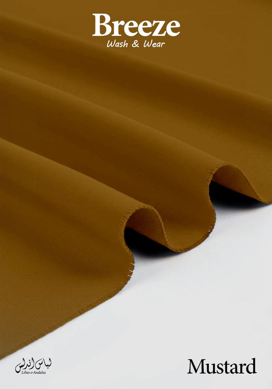 Mustard-colored fabric with 'Breeze Wash & Wear' branding on a white background