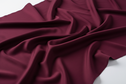 Close-up detail of premium wine burgundy wash and wear wrinkle-resistant fabric texture 52 inch width