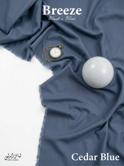 Cedar Blue Breeze Wash and Wear unstitched fabric for men draped in soft folds with frayed edges, Libas-E-Andalus