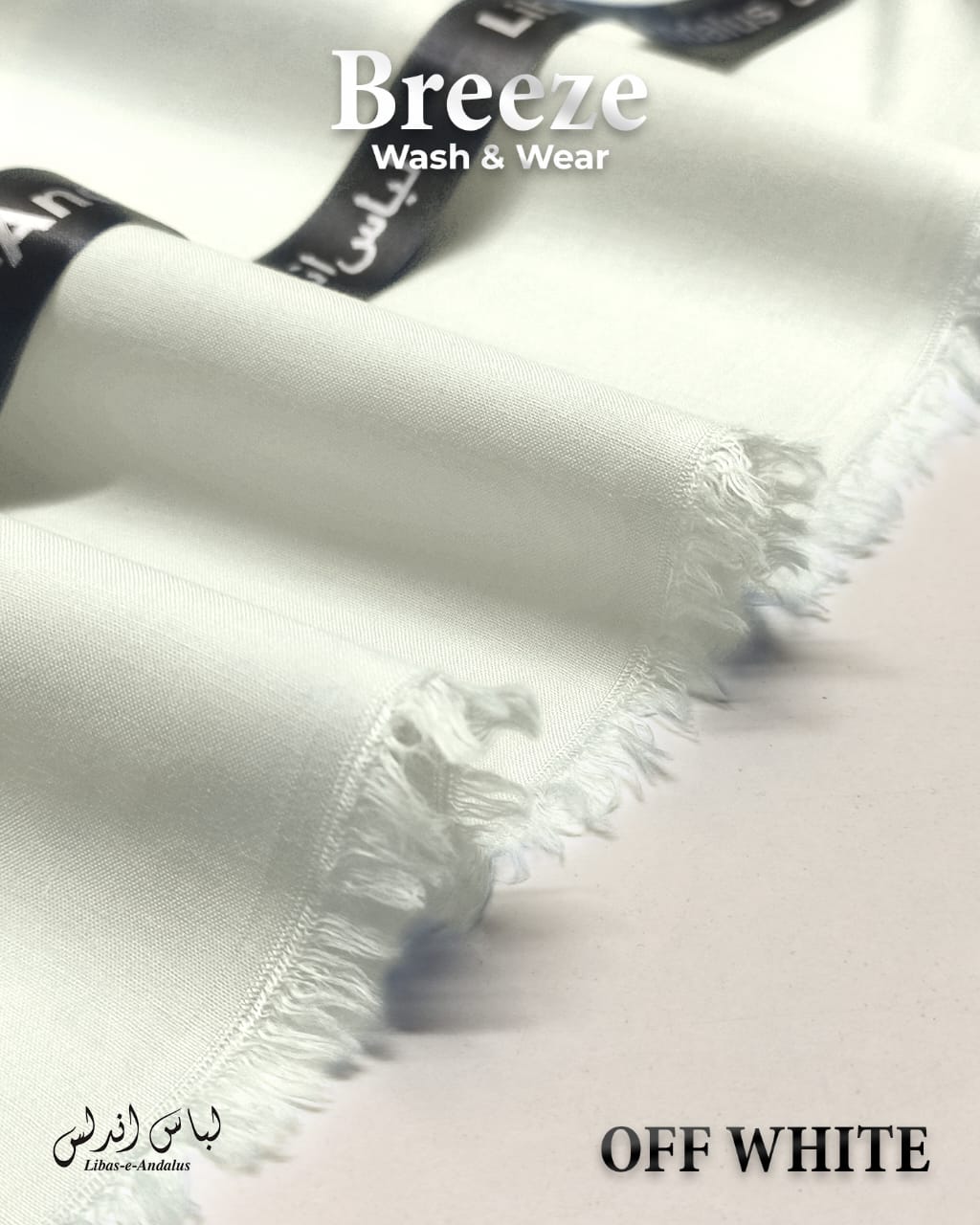 Close-up of a white fabric with 'Breeze Wash & Wear' branding and 'Off White' text.