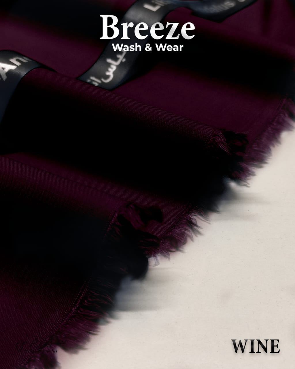 Wine-colored fabric with 'Breeze Wash & Wear' branding on a white background