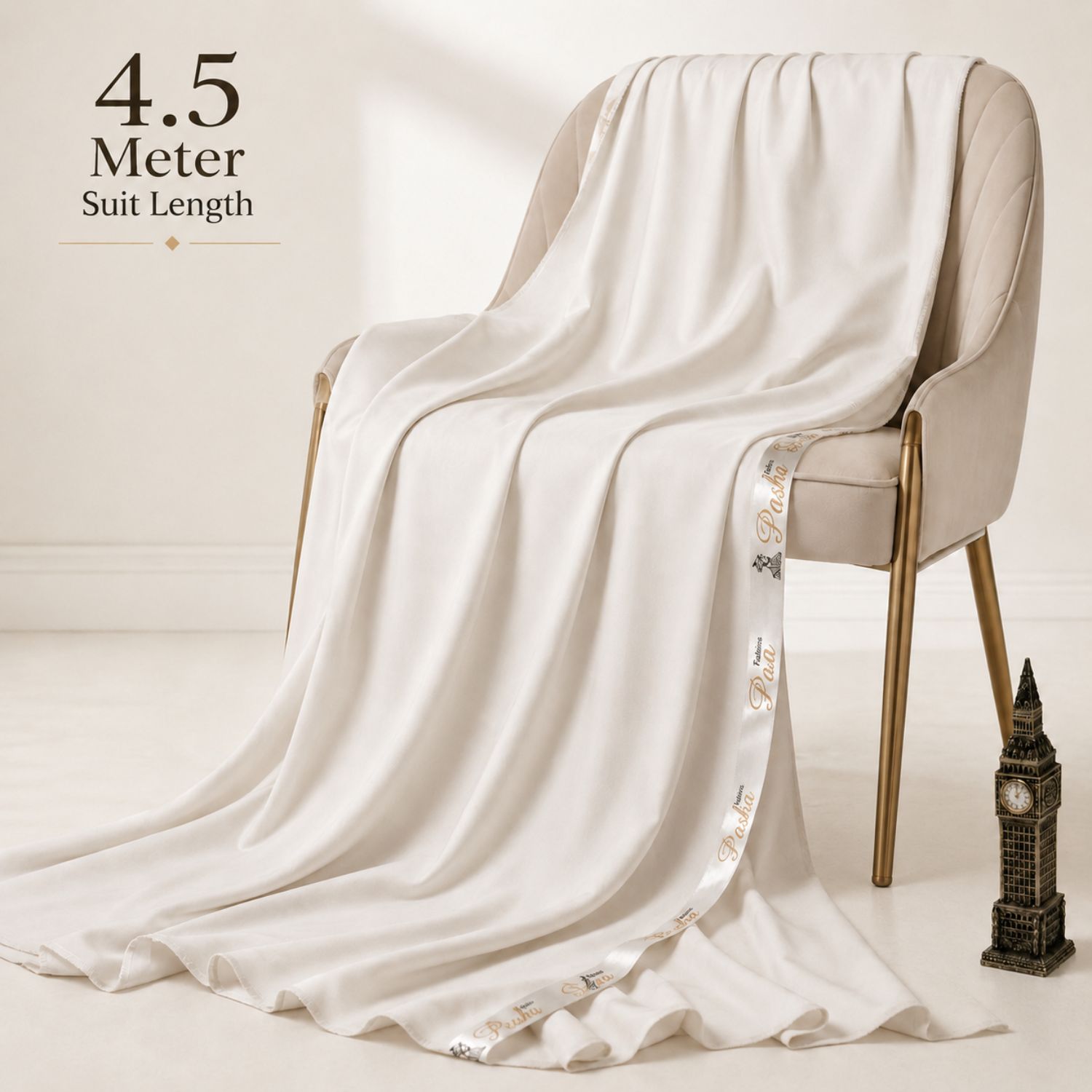 Pasha Premium Cotton Off White 4.5 meter unstitched suit fabric draped over a chair showing smooth fall and premium cotton texture.