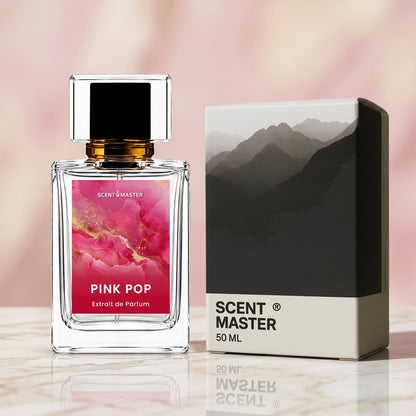 Pink Pop perfume bottle displayed next to its packaging box on a marble surface