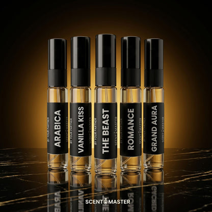 Set of five perfume bottles with black labels on a reflective surface.